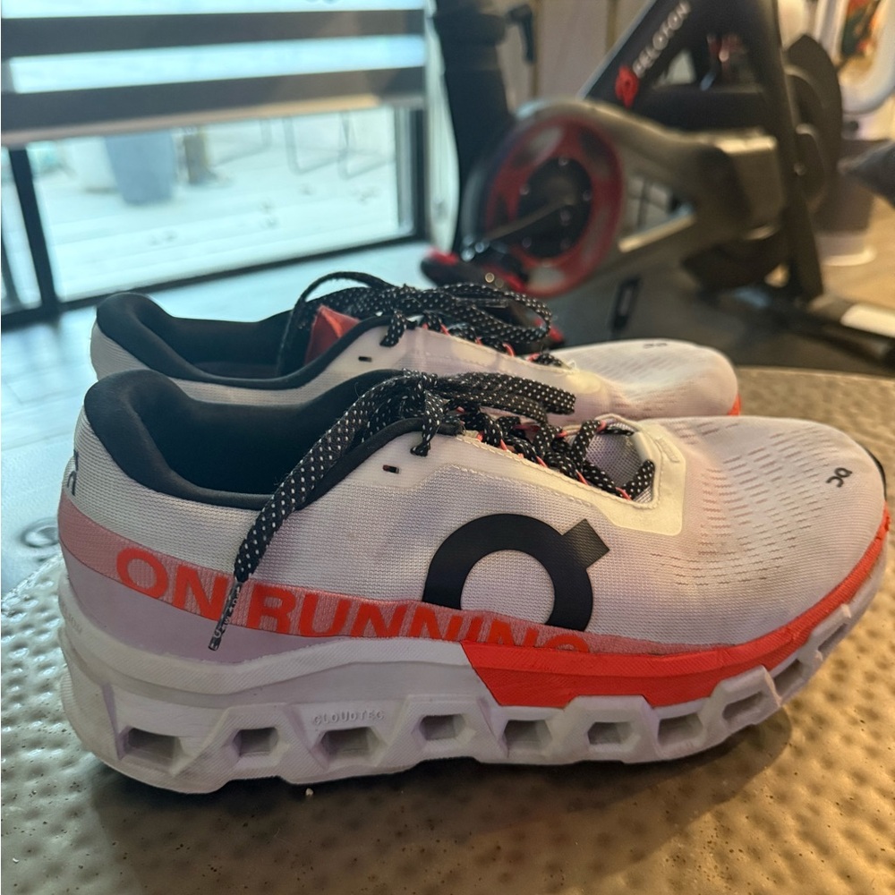On Running White and orange  Athletic Shoes. Good condition